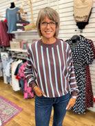 Ash brown and light blue vertical striped sweater with long batwing sleeves