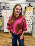 Pink and brown striped knit short sleeve crop top with ribbed trim and round neckline