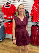 Merlot sleeveless mini dress with pintuck waist and gold button front detail