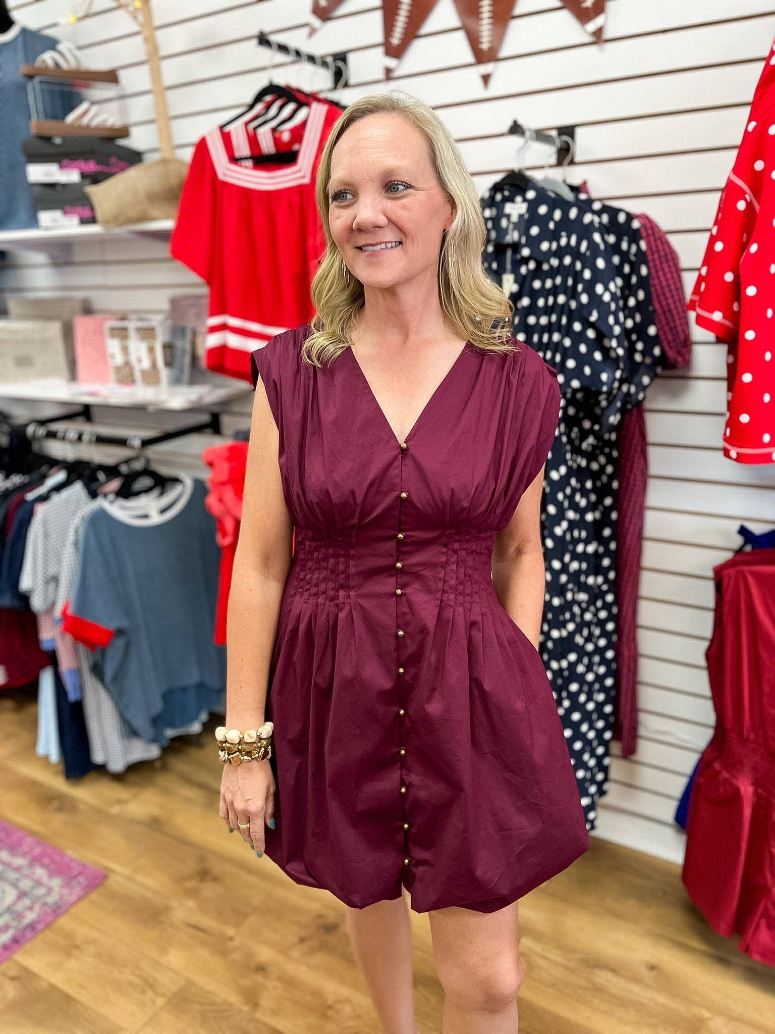 Merlot sleeveless mini dress with pintuck waist and gold button front by Entro