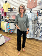 Olive green V-neck top with 3/4 balloon sleeves by Umgee