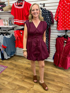 Merlot sleeveless bubble dress with pintuck waist and gold button front