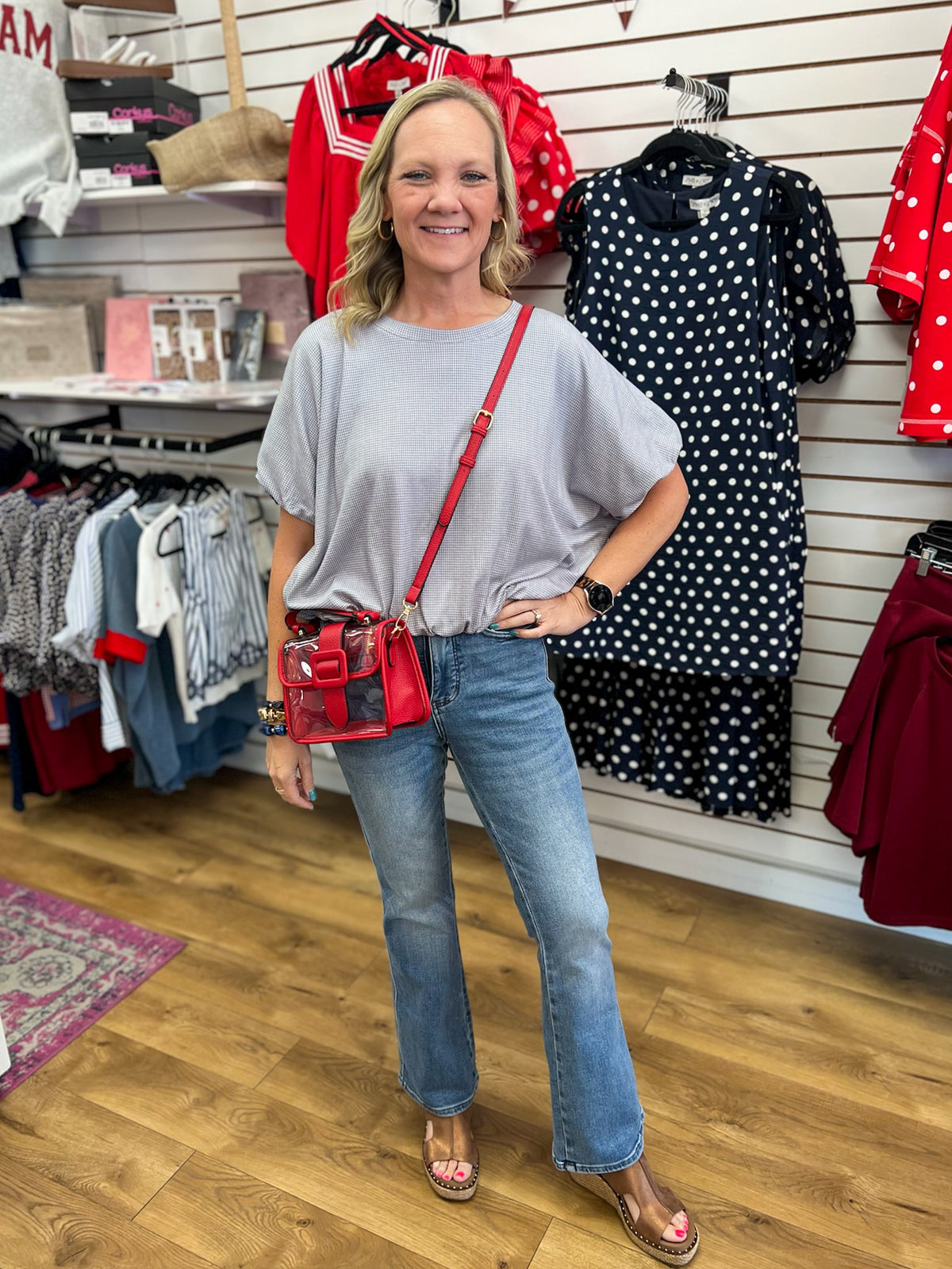 Woman wearing Judy Blue light wash petite bootcut jeans with high waist fit
