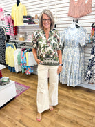 Entro olive floral short puff sleeve top with geometric hem trim detail