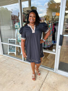 Curvy black dress with contrast animal print details lined v-neck pockets 