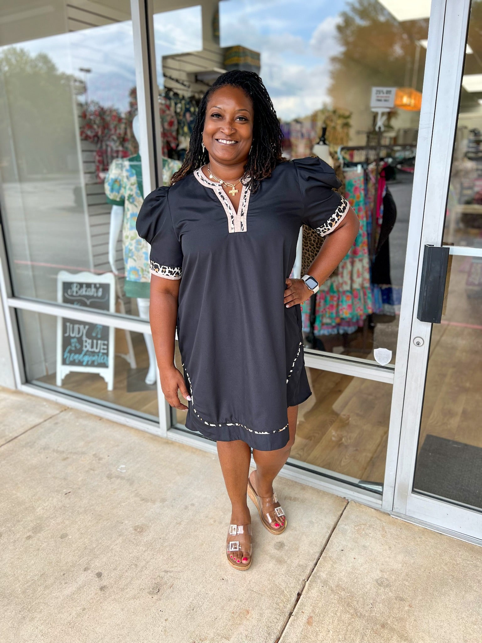 Curvy black dress with contrast animal print details lined v-neck pockets 