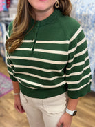 Hunter green and cream striped 3/4 sleeve knit sweater with button henley neckline