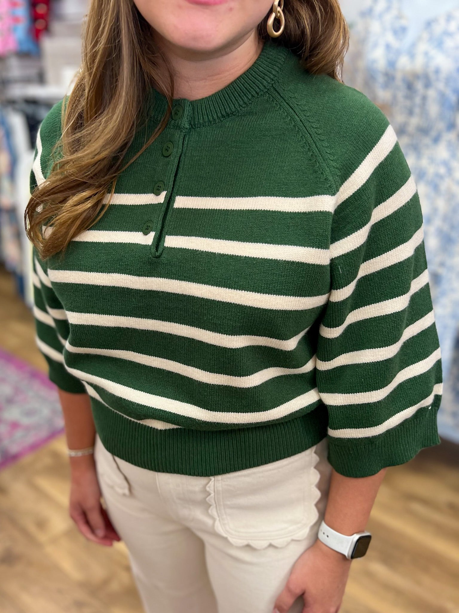 Hunter green and cream striped 3/4 sleeve knit sweater with button henley neckline