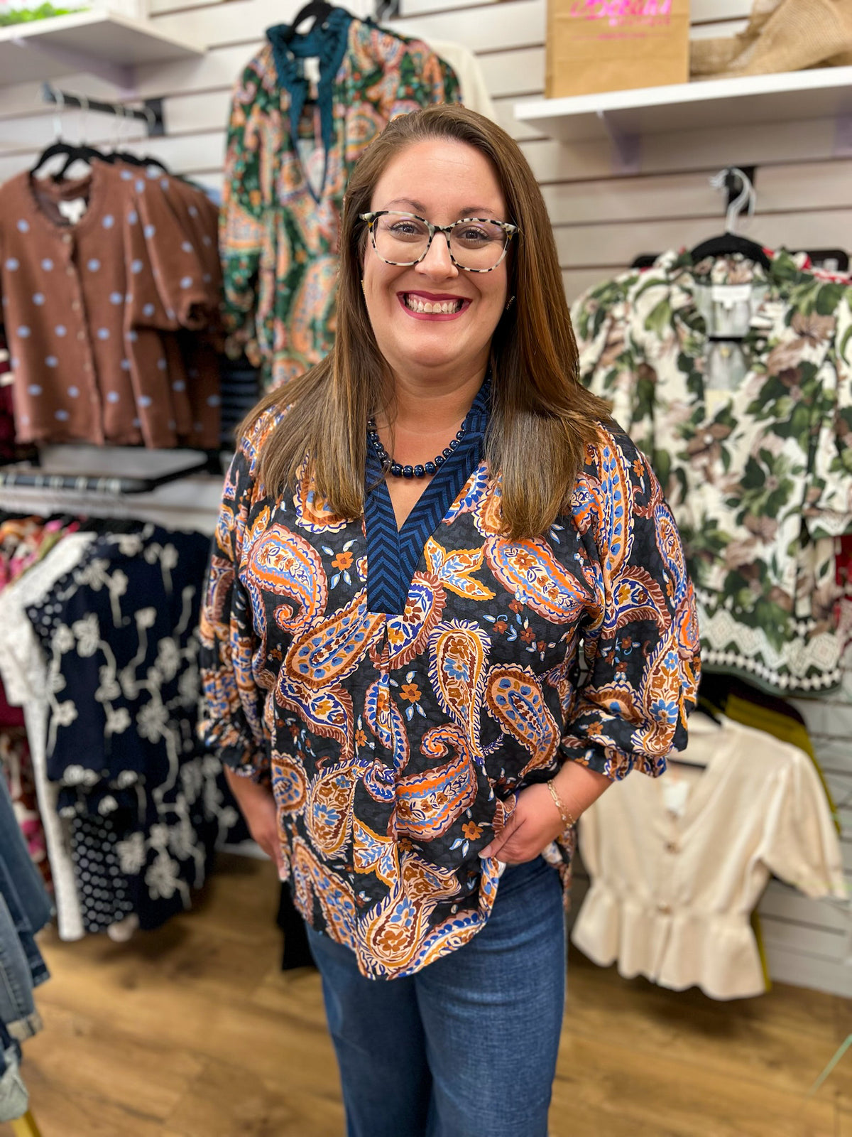 Umgee black paisley print V-neck top with 3/4 balloon sleeves in blue and rust