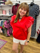 She + Sky red V-neck top with ruffled flutter sleeves and white pinstripe detail