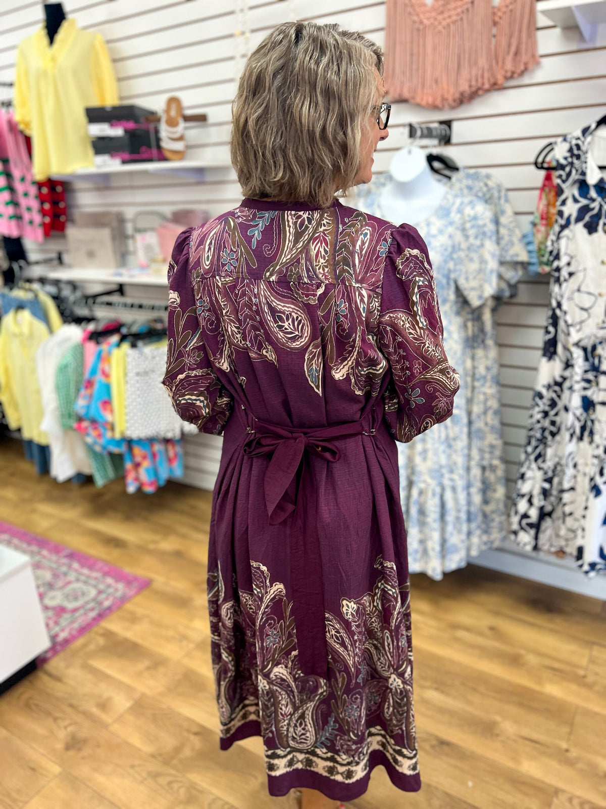 Plum paisley midi dress with tie waist and puff sleeves, back view