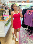 Lulu Mac red athletic mini dress with white trim and spaghetti straps