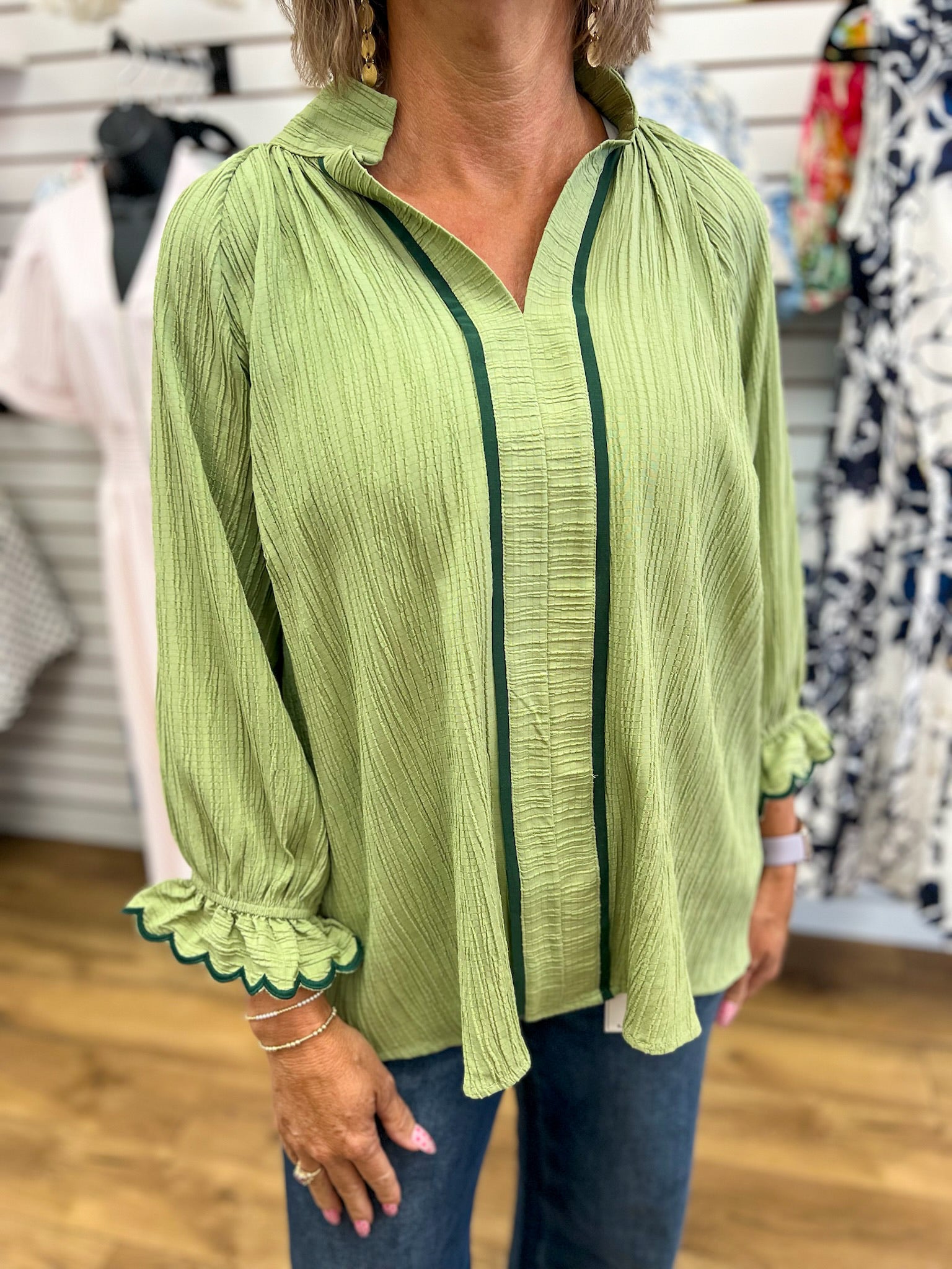 Sage green crinkle blouse with dark green contrast trim and scalloped 3/4 sleeves