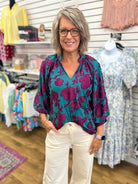 Umgee teal floral V-neck top with purple blooms and 3/4 balloon sleeves