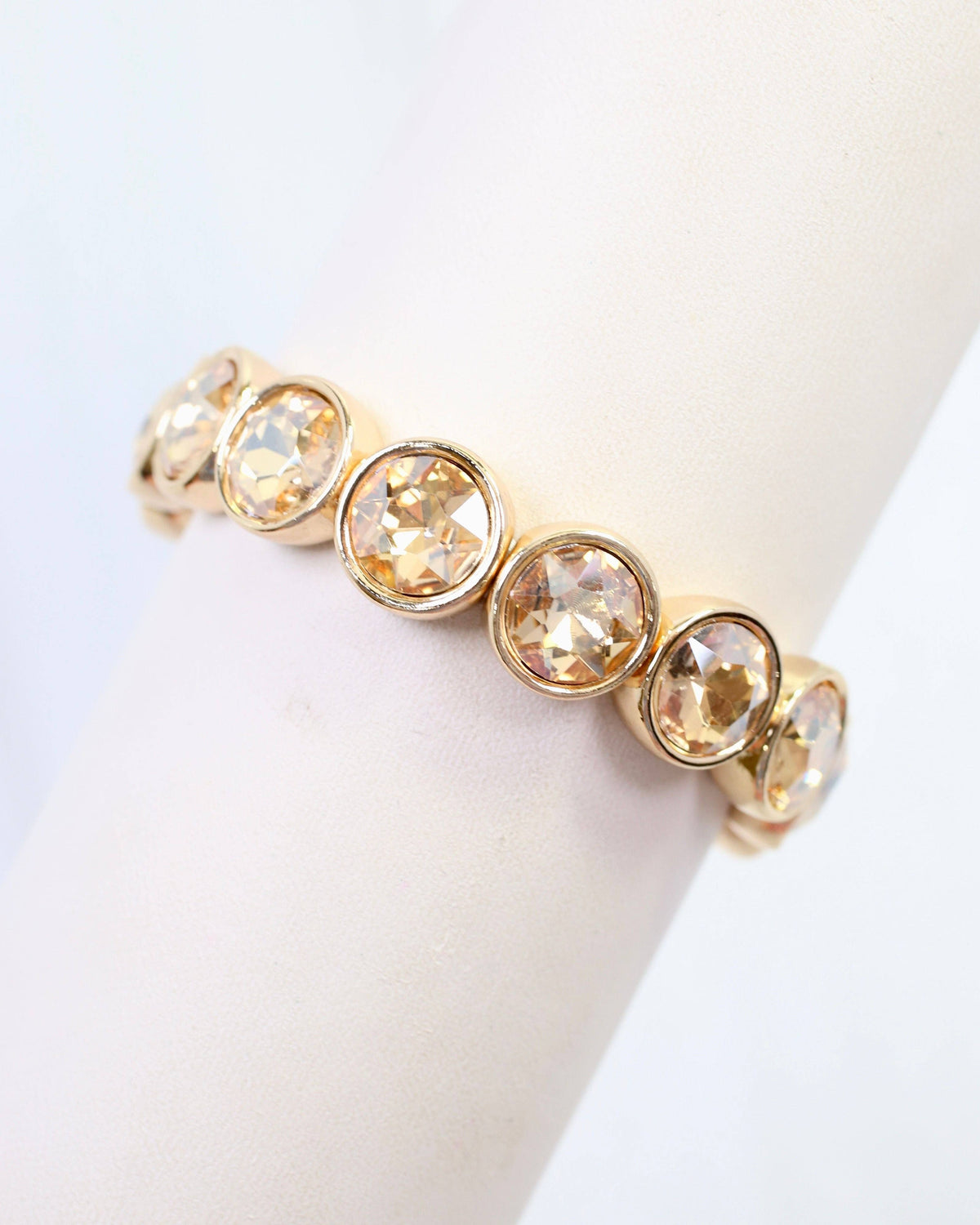 Champagne crystal stretch bracelet with round bezel-set stones in gold tone setting