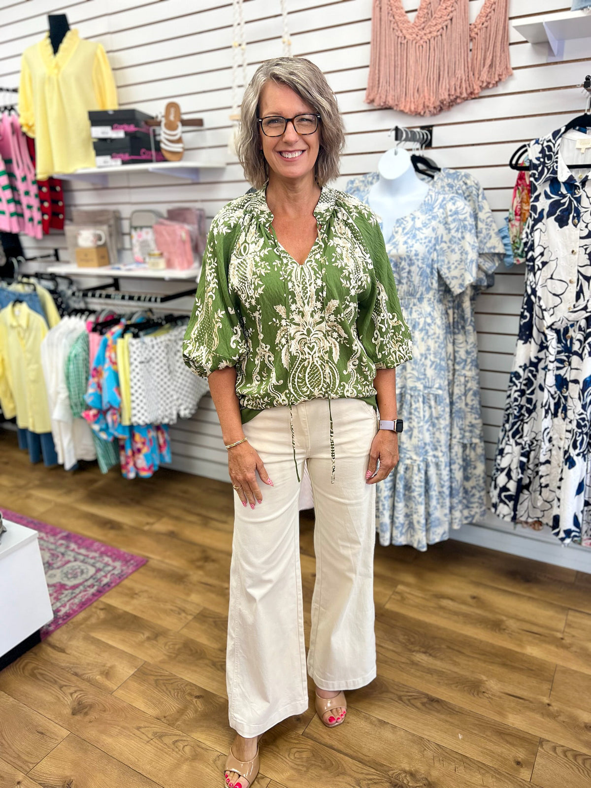 Olive green boho border print top with 3/4 balloon sleeves and cream floral pattern