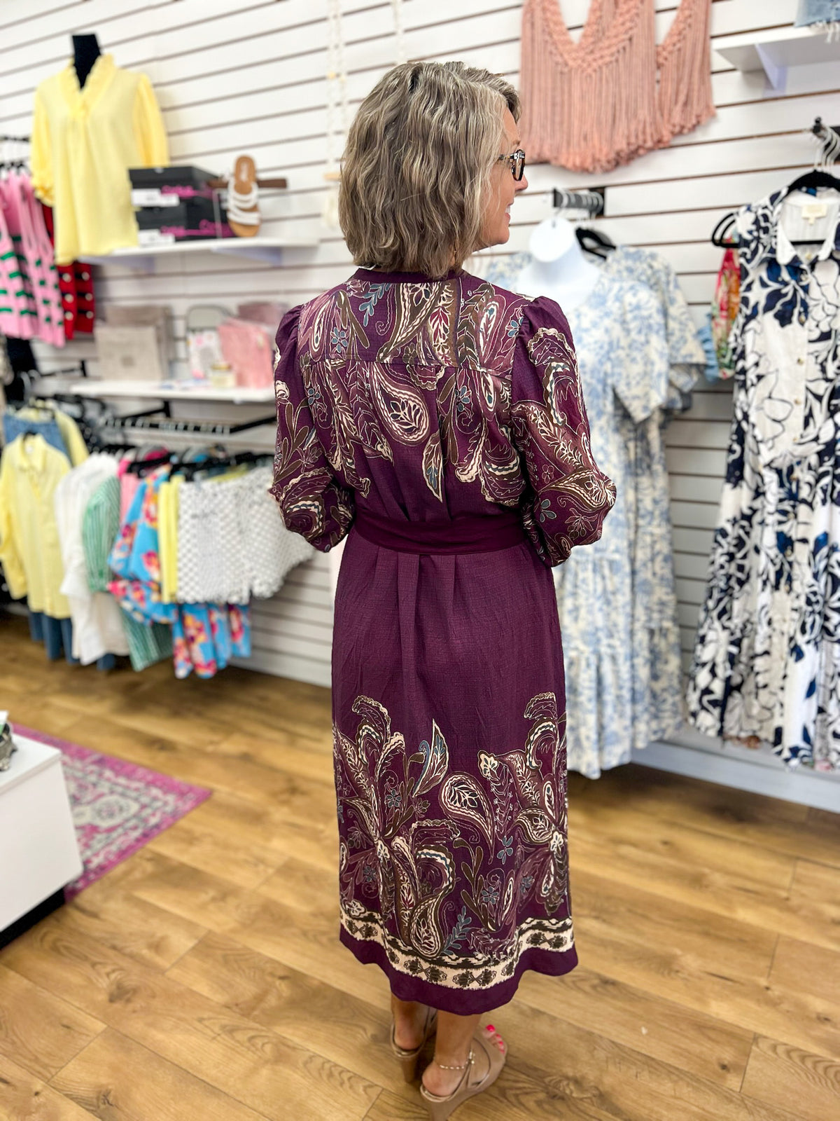 Plum paisley midi dress with tie waist and long sleeves, back view