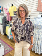 Umgee black paisley boho top with 3/4 puff sleeves and smocked neckline