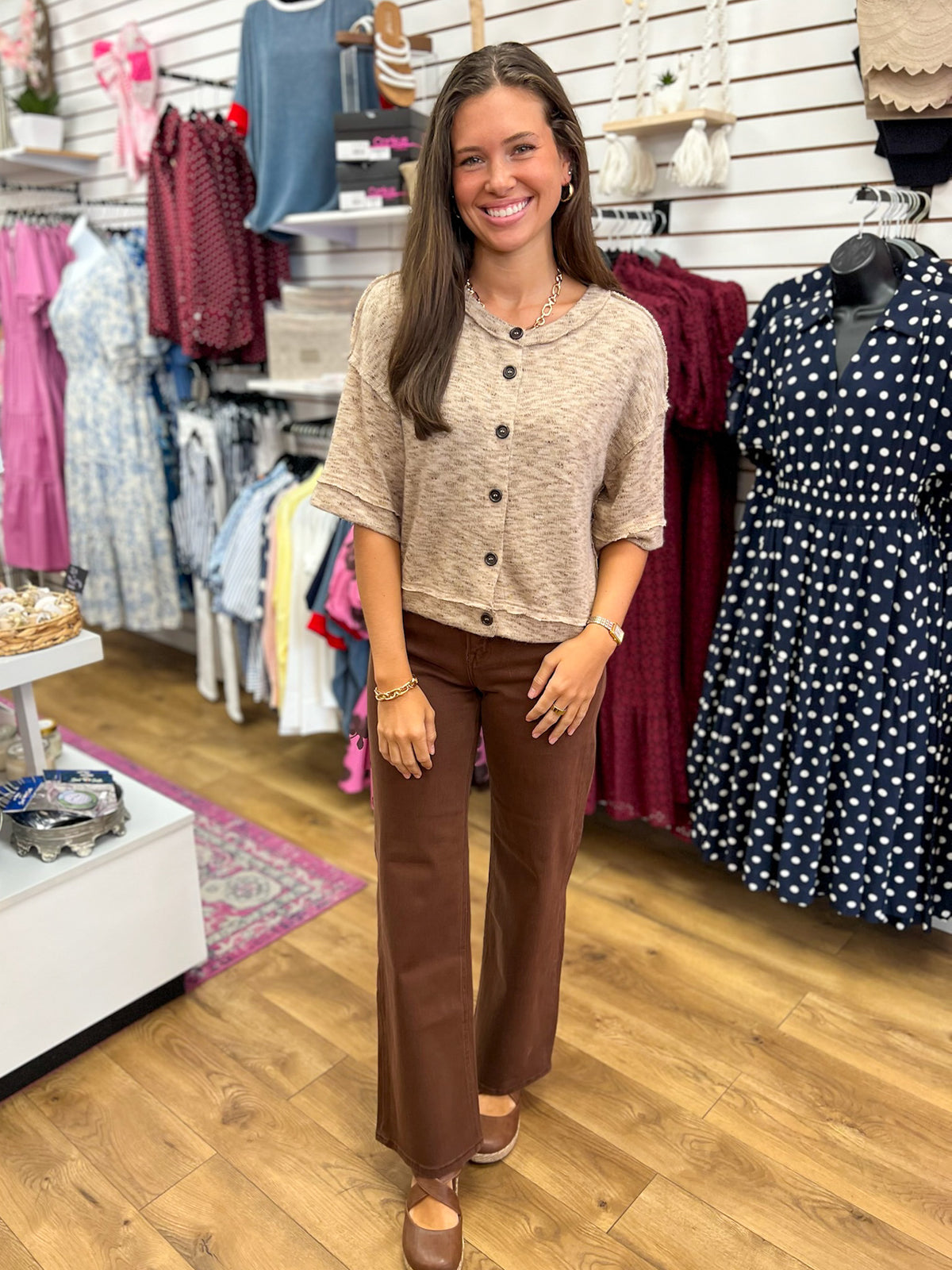 Light taupe marled short sleeve button-down knit top styled with brown wide-leg pants