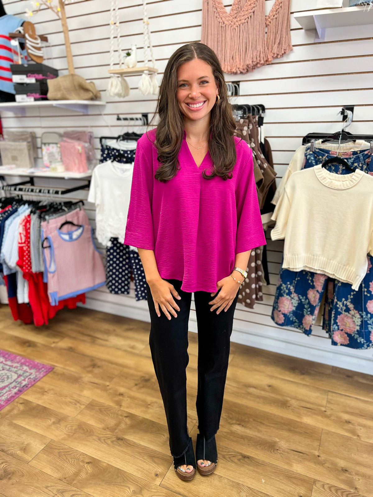 Magenta V-neck oversized top with 3/4 sleeves, worn with black pants
