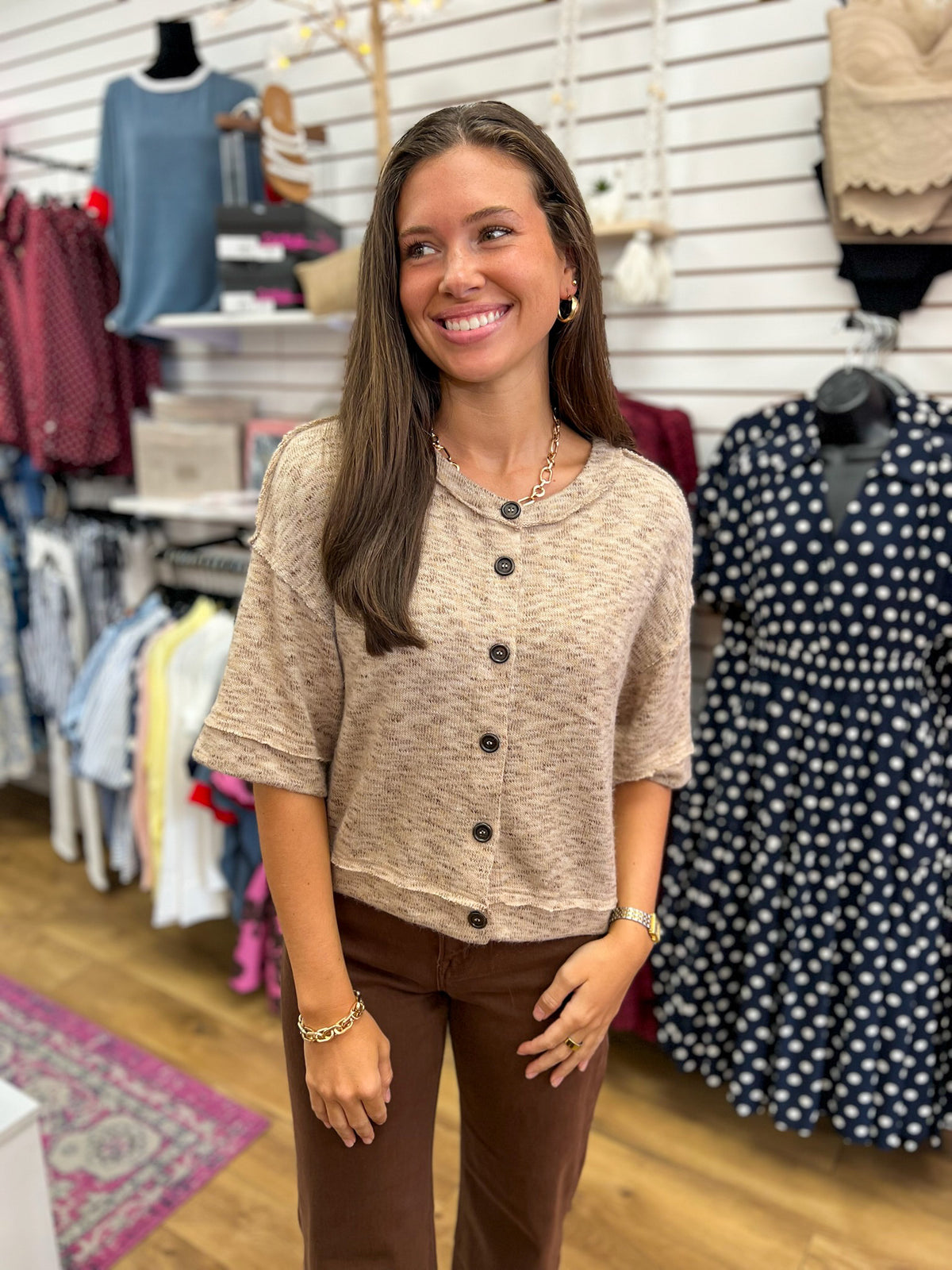 Light taupe marled knit button-down short sleeve top with raw-edge hem detailing