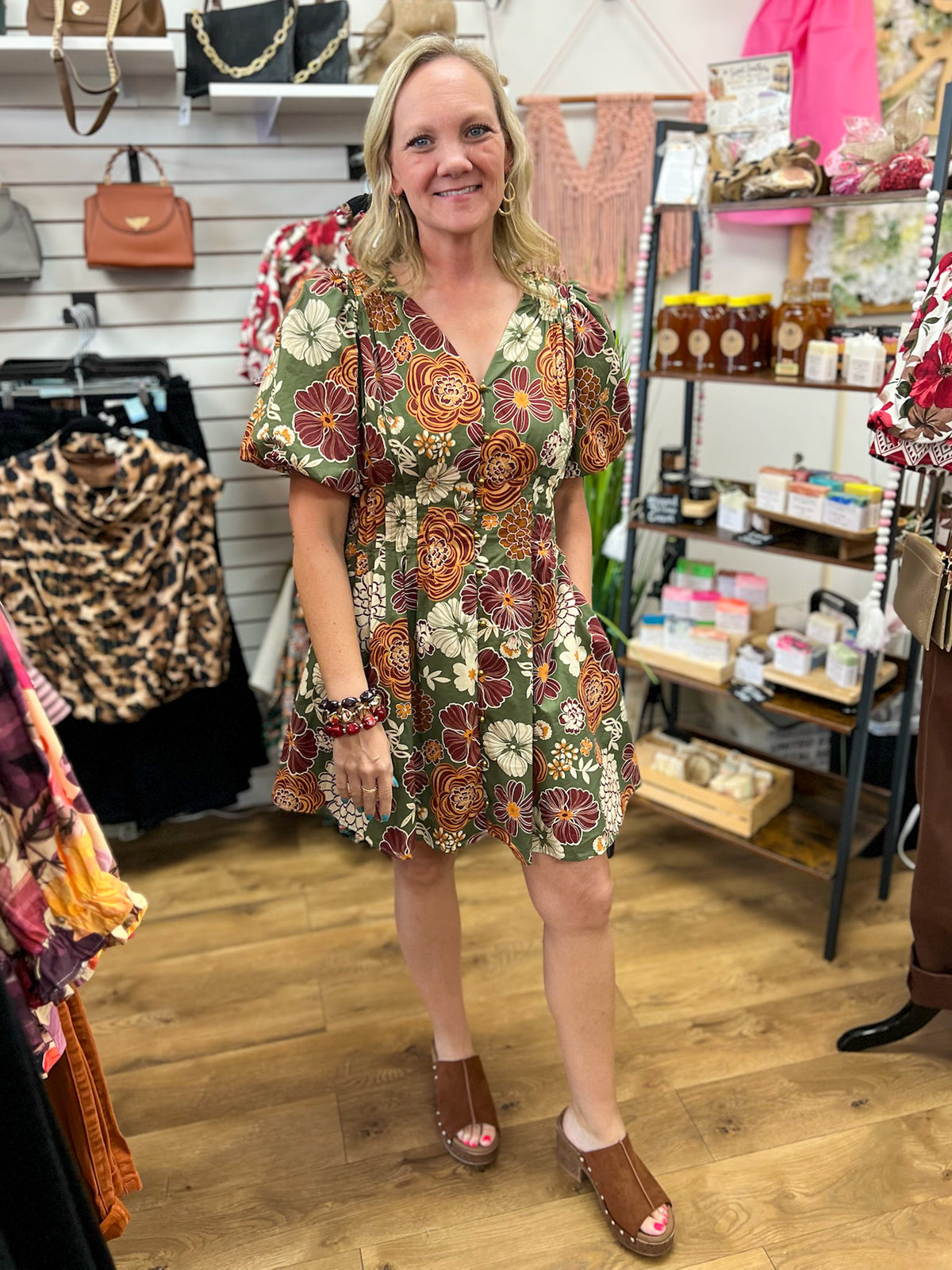 Olive green floral mini dress with rust burgundy blooms and short puff sleeves