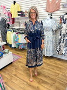 Navy paisley abstract print midi dress with tie waist and nude heeled sandals