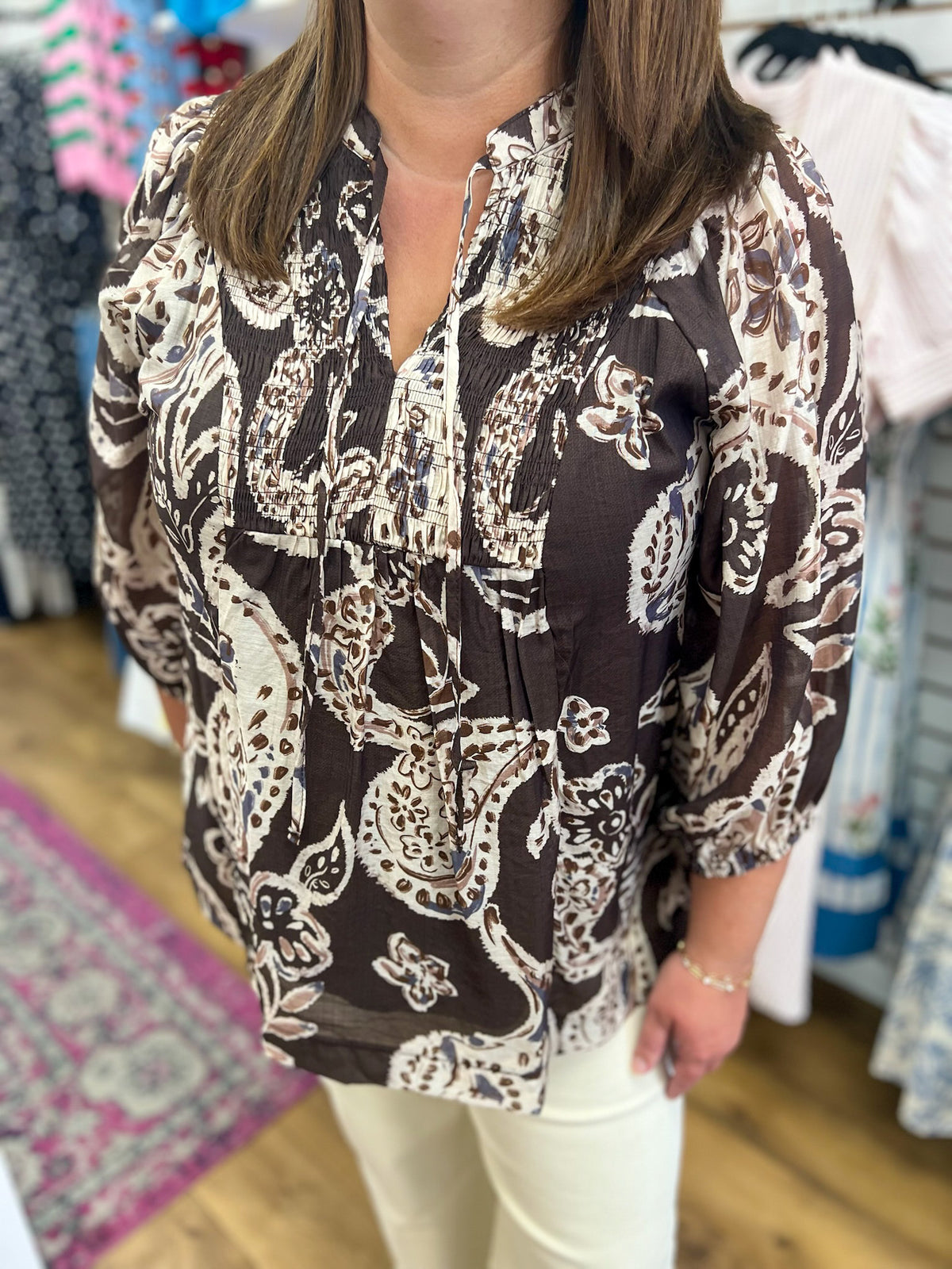 Umgee brown paisley print tunic top with smocked chest and self-tie neckline