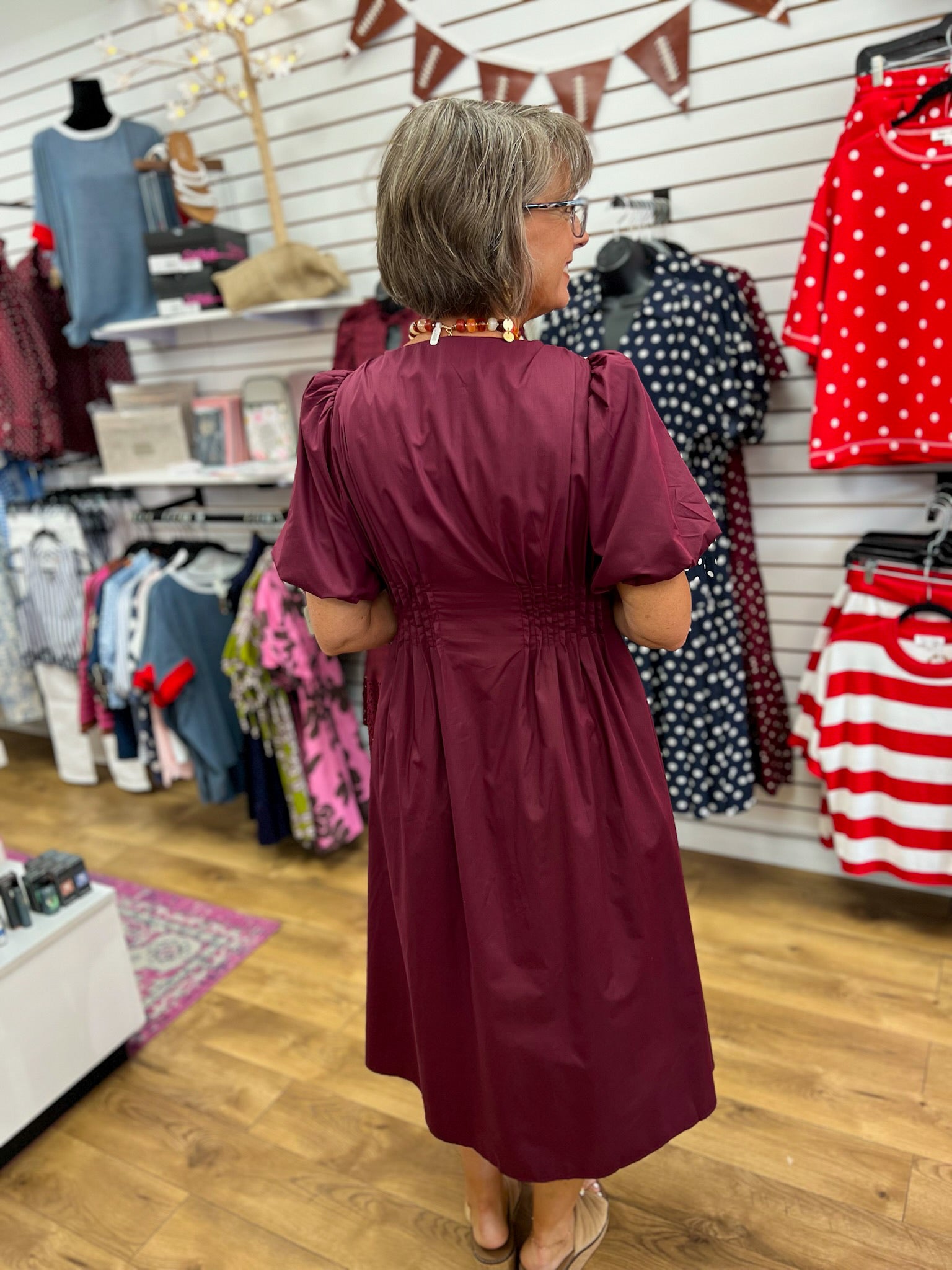 Wine burgundy midi dress with smocked waist and puff sleeves, back view
