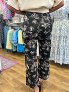 Umgee black wide leg cropped pants with gray and taupe floral print, back view