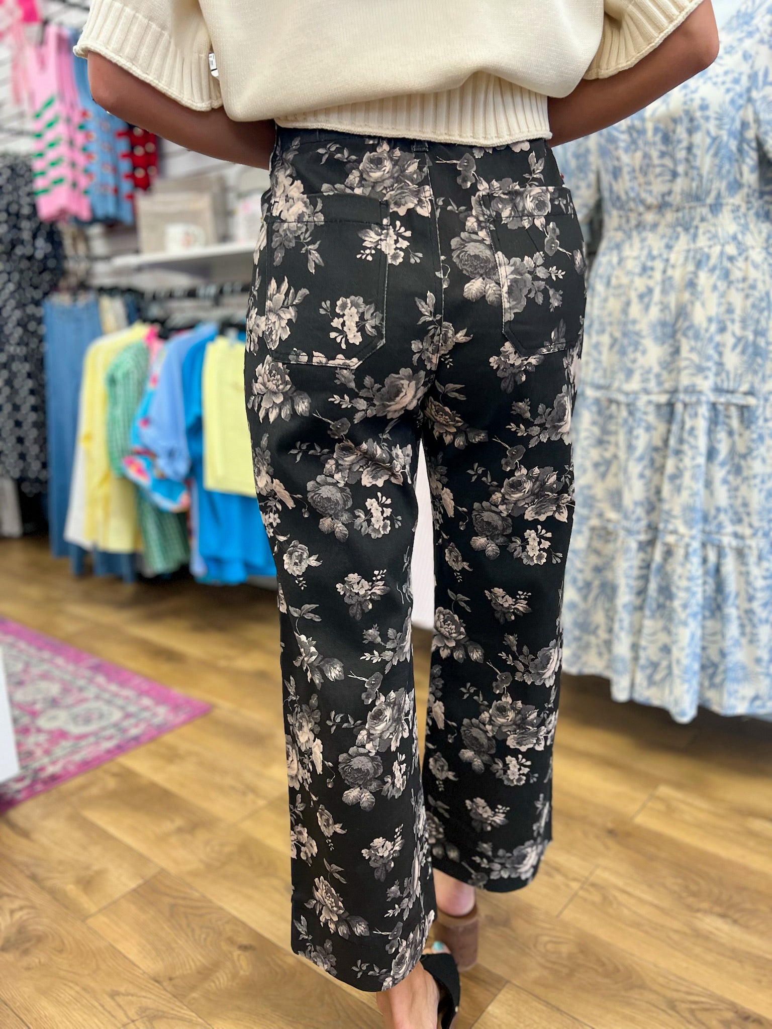 Umgee black wide leg cropped pants with gray and taupe floral print, back view