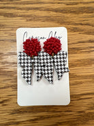 Red seed bead and black white houndstooth bow dangle earrings on display card