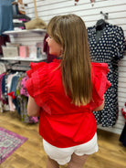 She + Sky red ruffle sleeve V-neck top paired with white scallop shorts