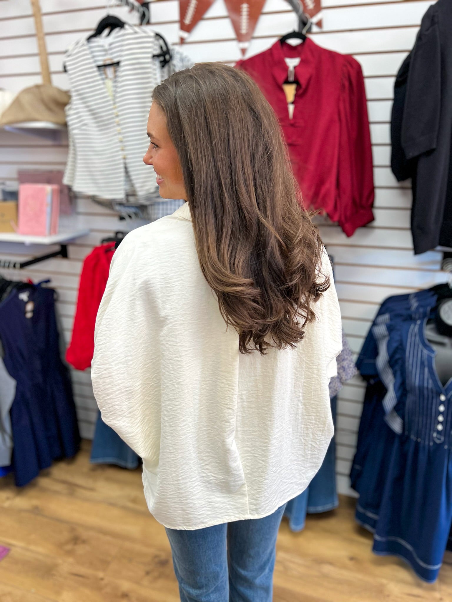 Ecru textured button down top with short dolman sleeves, back view