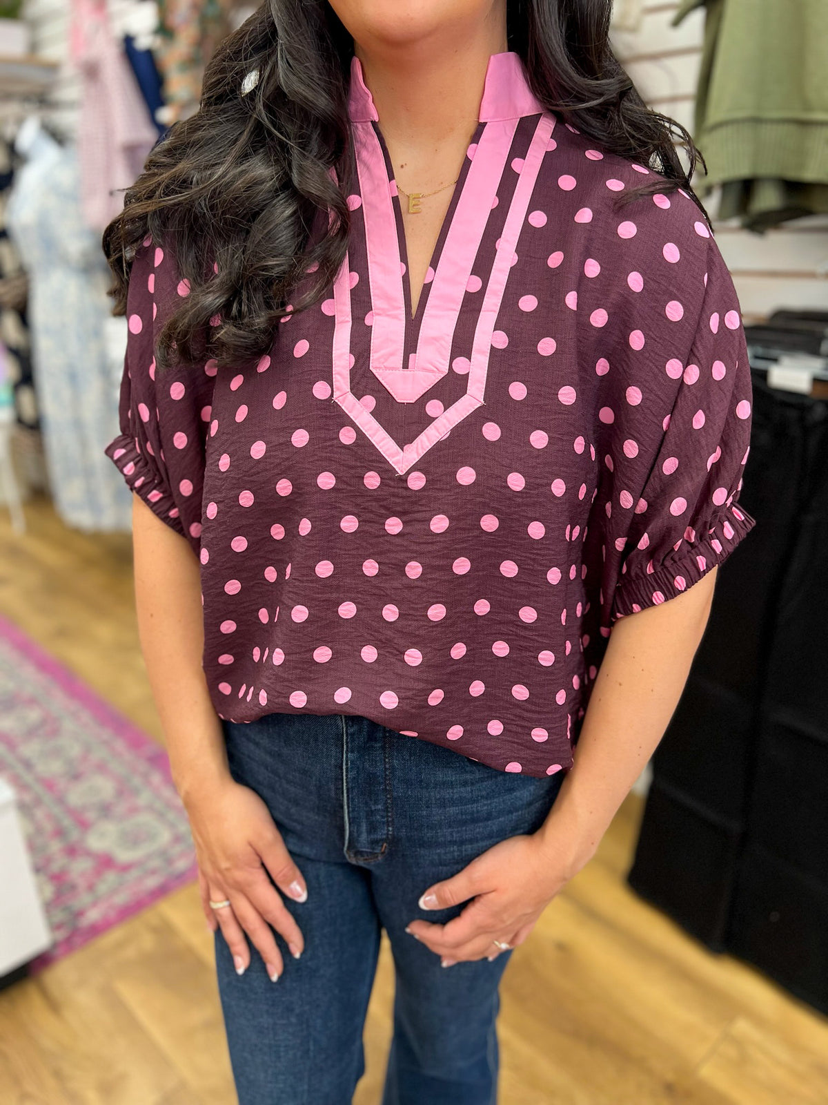 Wine polka dot V-neck top with pink trim and short dolman sleeves
