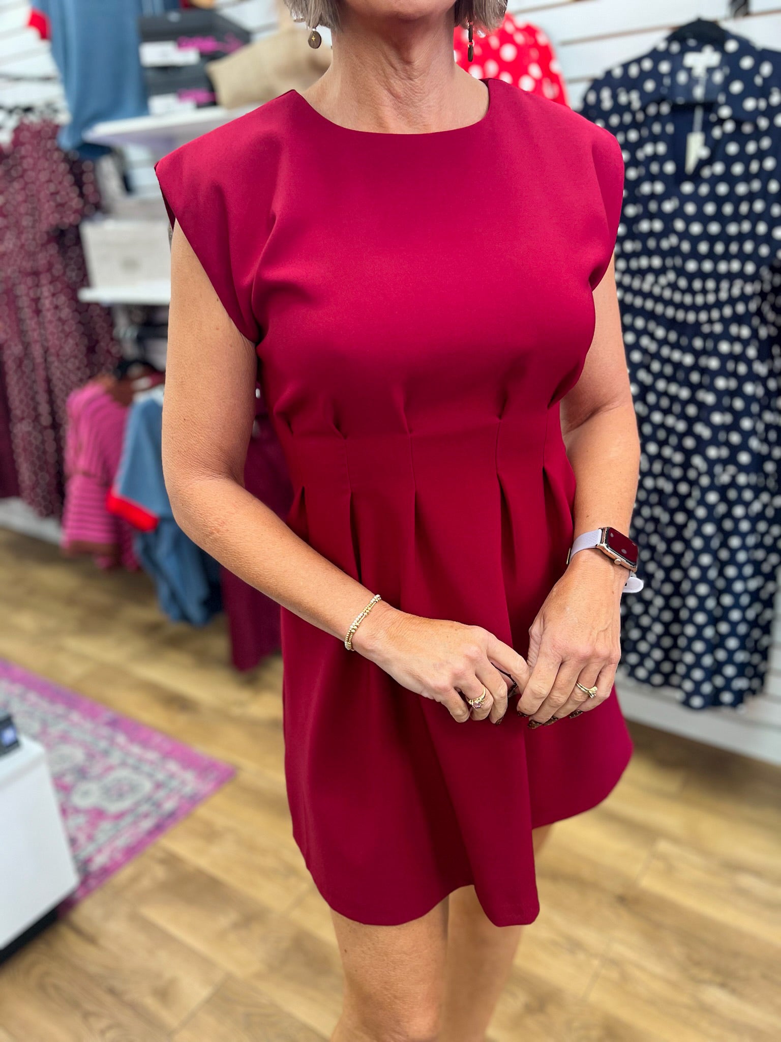Glam burgundy sleeveless A-line dress with pleated waist and cap shoulders