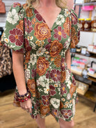 Olive green floral mini dress with rust and burgundy blooms and puff sleeves