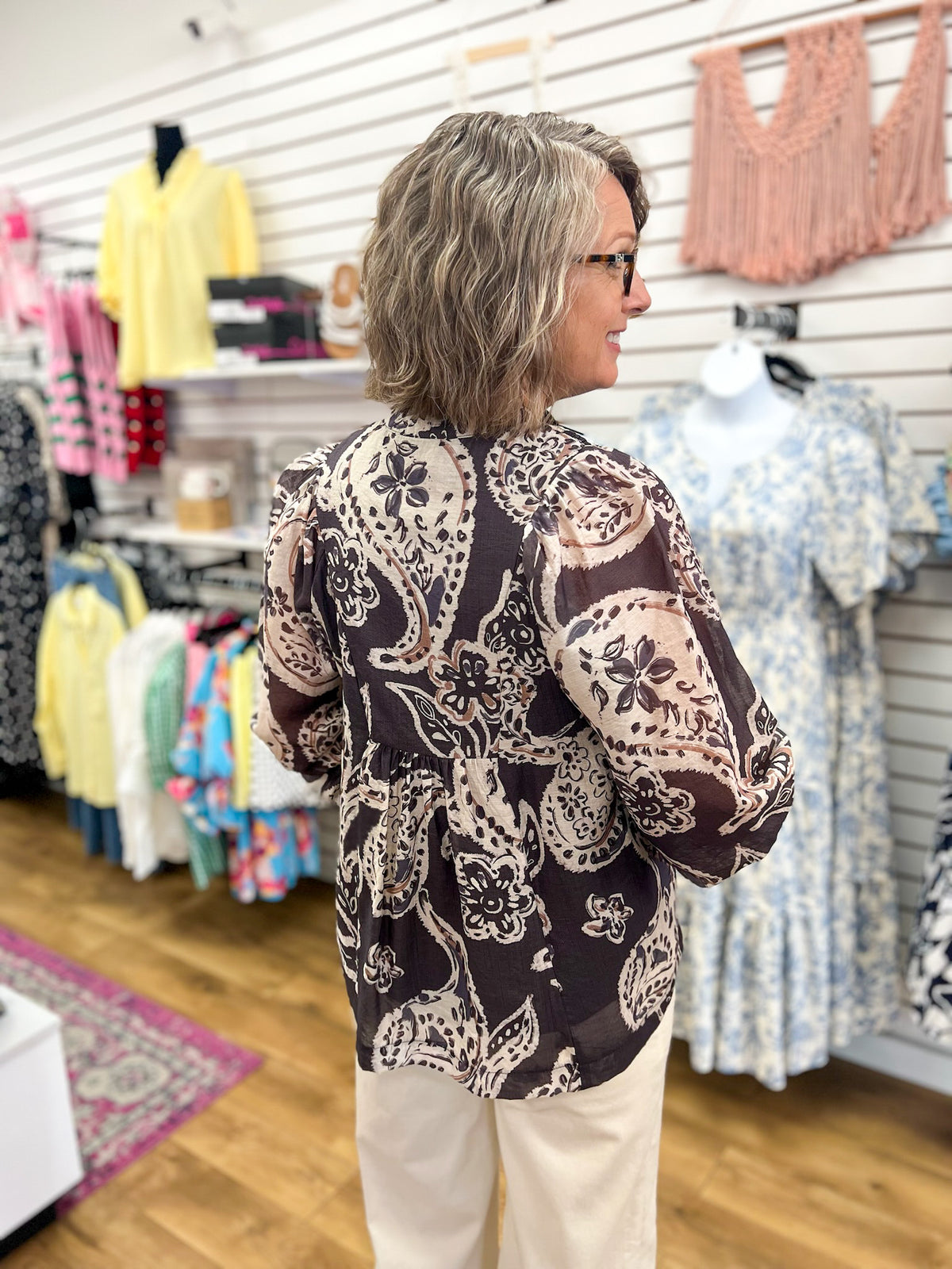 Black and cream paisley boho blouse with 3/4 sleeves, back view
