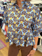 Blue Floral Top with Puff Sleeves and Ruffle Hem - A'Bekah's Boutique