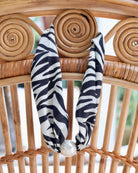 Black and ivory zebra print scarf necklace with large pearl magnetic closure