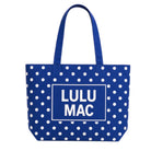 Royal blue polka dot canvas tote bag with white LULU MAC logo and handles
