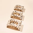 Three blonde tortoise flat rectangle hair claw clips in small, medium, and large sizes