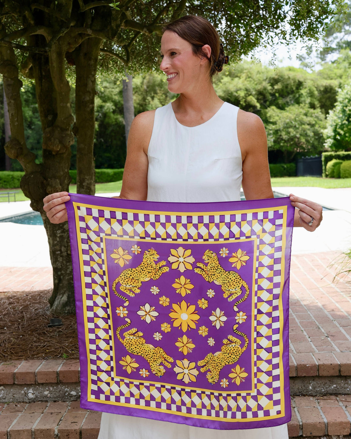 Purple and gold silk scarf with leopard print floral design and geometric checkered border
