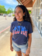 LULU MAC Navy Short Sleeve T-Shirt with American Flag Lettering - A'Bekah's Boutique