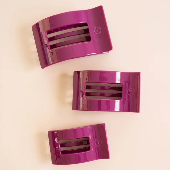 Three mulberry purple glossy flat rectangle hair clips in small medium large sizes