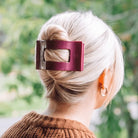 Mulberry large flat rectangle hair clip securing a blonde updo hairstyle
